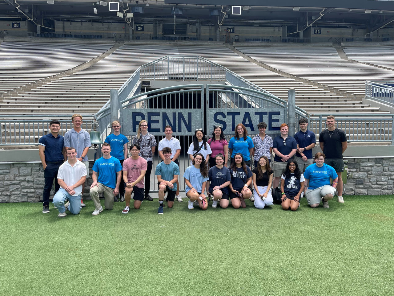 Minitab Interns standing in front of Penn State Beaver Stadium gate